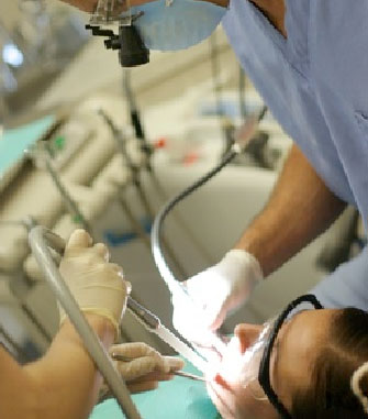Dr. Kelly working on a dental procedure - dental visit teeth cleaning Scottsdale Arizona